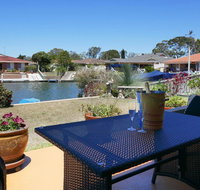 Waterfront Haven with jetty mooring and WiFI - Accommodation Coffs Harbour